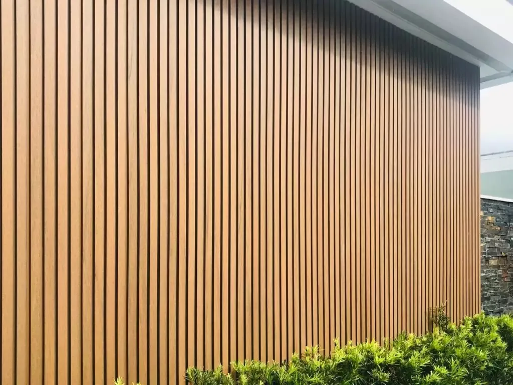 Brown wood-grain WPC cladding installed on building façade